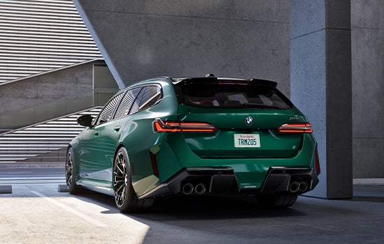 Green BMW M5 Touring parked in garage. | BMW of Roxbury in Kenvil NJ