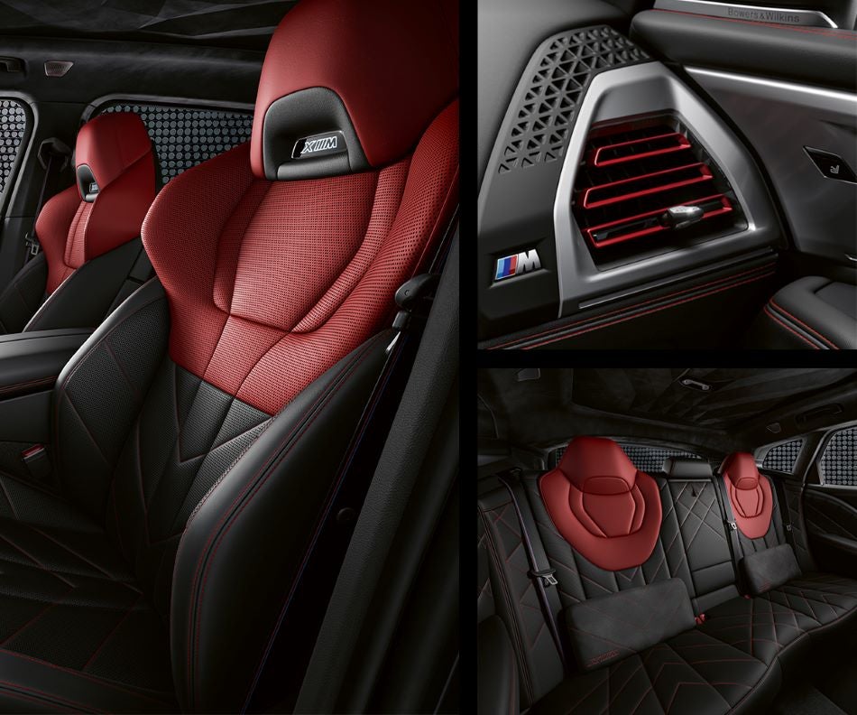 Detail of front seats, clad in exclusive BMW Individual Fiona Red & Black Merino Leather with exclusive M Signature Trim and red stitching and accents. Detail of red accented vent. Detail of rear M Lounge with exclusive XM pillows in BMW of Roxbury | Kenvil NJ
