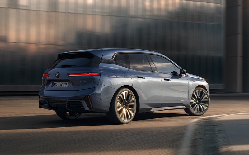 The BMW iX driving with the front wheel turned. | BMW of Roxbury in Kenvil NJ